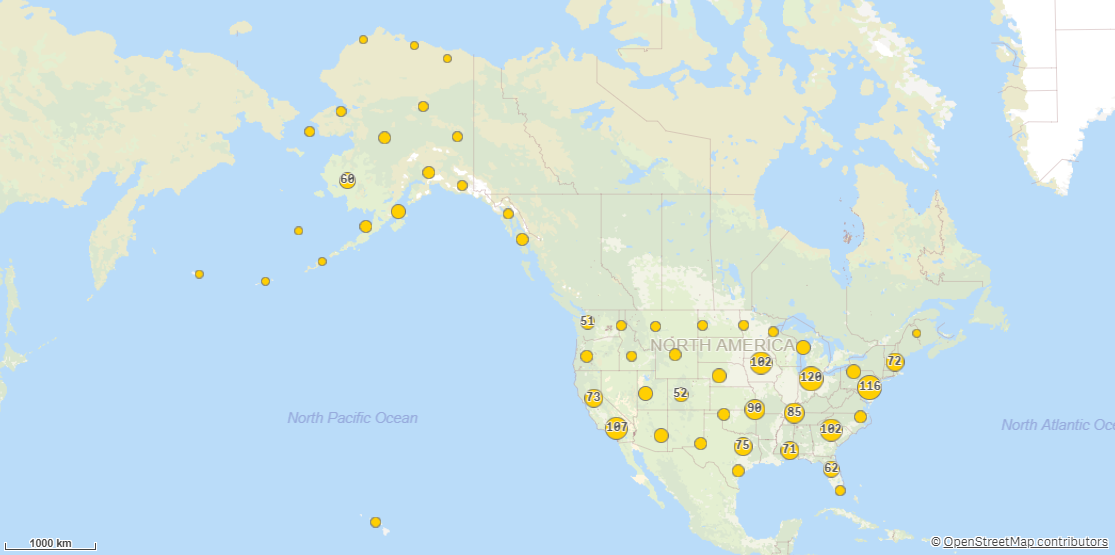 A map displaying various points, with grouped points condensed into a single, larger point that displays the total number of points it contains.